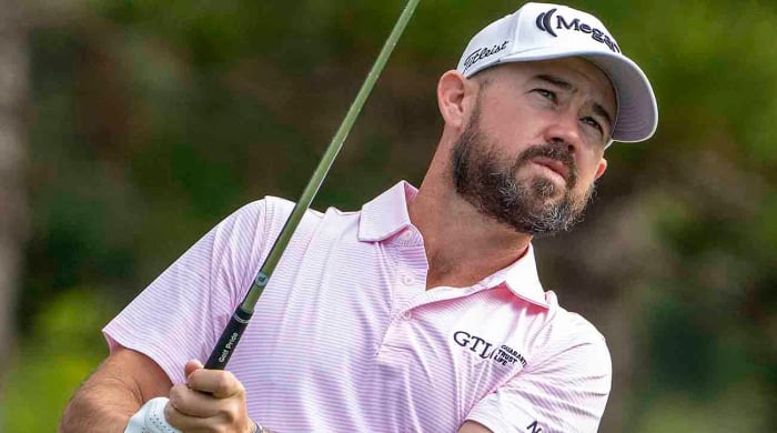 Brian Harman regarde un coup lors du Sentry Tournament of Champions 2023 à Kapalua, Hawaii.